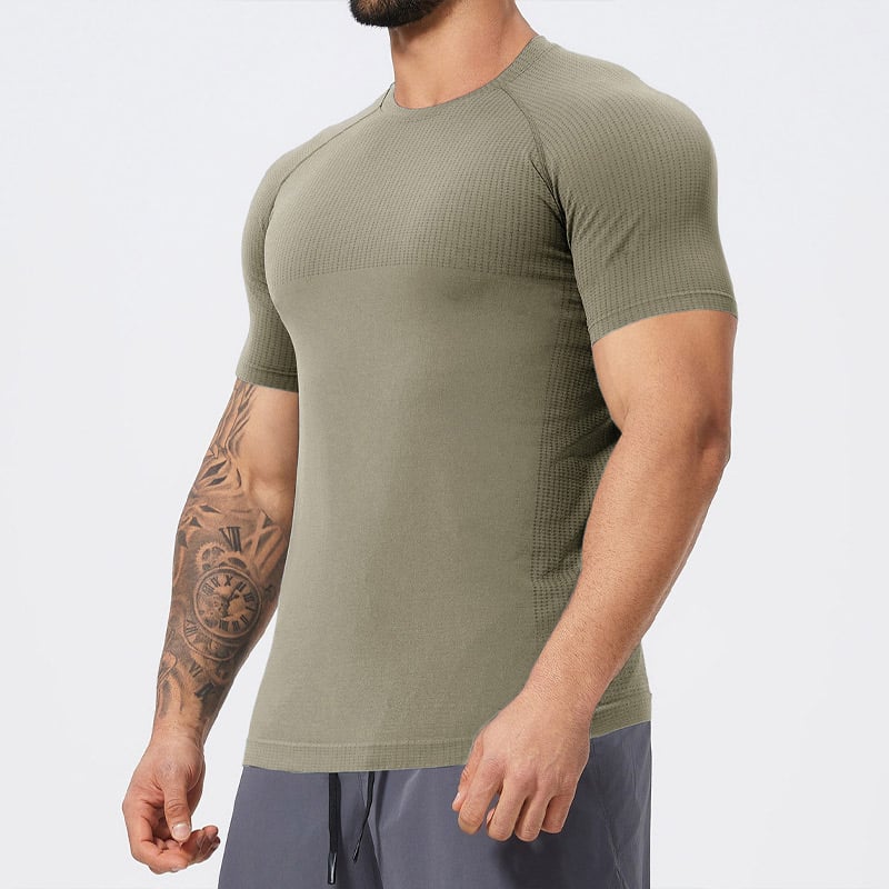 Menโs olive green engineered athletic short sleeve tee with segmented grid mesh vent panels on shoulders and sides, seamless raglan construction for gym training.
