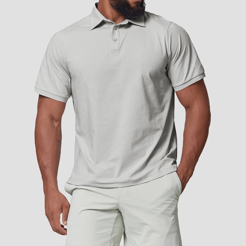 Studio shot of menโs pale light grey seamless performance golf polo, raglan vented shoulder knit construction, standard 2-button placket, soft matte seamless stretch knit paired with matching light golf shorts, sweat-wicking all-day performance fabric.
