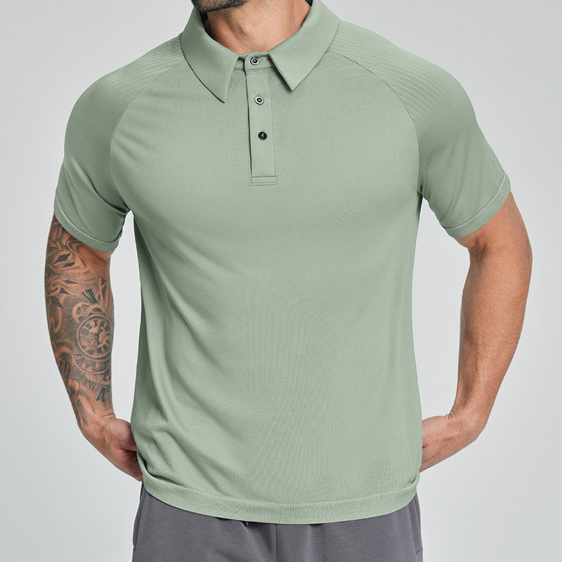 Menโs sage green technical performance polo shirt with textured raglan sleeve panels, three-button placket, breathable quick-dry knit fabric for golf & training.