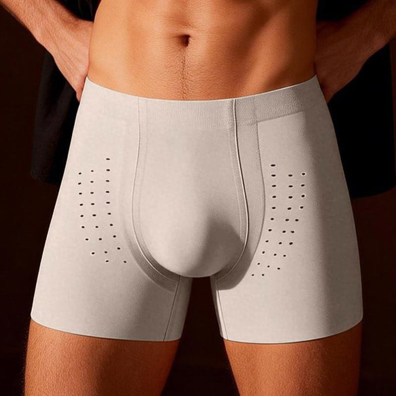 Front close-up studio shot of menโs light grey seamless boxer briefs, breathable perforated hole ventilation design on thigh panels, wide seamless elastic waistband, contoured 3D pouch, soft lightweight stretch fabric for daily wear, sports and gym use, professional custom menโs underwear boxer brief OEM factory.