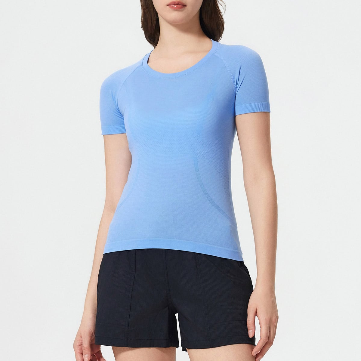 Studio front shot of womenโs sky blue everyday China seamfree t-shirt, classic round neck raglan short sleeve design, subtle contour jacquard breathable mesh panels, smooth lightweight stretch seamless knit, slim tailored fit for daily wear, yoga, commuting and light training, factory direct everyday seamfree performance tee wholesale from China.